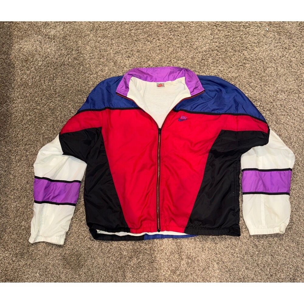 Step back into classic 90s streetwear with this authentic vintage windbreaker
